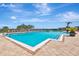 Large community pool with lounge chairs and sunny skies, perfect for relaxation and recreation at 915 Tidewater Shores Loop, Bradenton, FL 34208