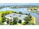 Aerial view of community tennis courts with landscaping and waterfront views at 915 Tidewater Shores Loop, Bradenton, FL 34208