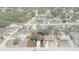 Aerial shot of home showcasing fenced yard and updated roof within a residential neighborhood at 10101 Langan St, Spring Hill, FL 34608