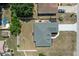 Aerial view of the property showing the roof, yard, and surrounding neighborhood at 10101 Langan St, Spring Hill, FL 34608