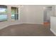 Bright dining area with tile flooring, windows, and access to the screened in patio at 10101 Langan St, Spring Hill, FL 34608