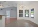 Bright dining area with tile flooring, modern lighting, and access to the living room at 10101 Langan St, Spring Hill, FL 34608