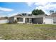 Attractive single-story home featuring dormer windows and a well-maintained front lawn at 10101 Langan St, Spring Hill, FL 34608