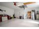 Garage with white walls, showing the garage door and storage shelf at 10101 Langan St, Spring Hill, FL 34608