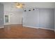 Spacious living room featuring hardwood floors, stylish lighting, and a neutral color scheme at 10101 Langan St, Spring Hill, FL 34608
