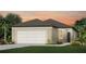 Charming one-story home with a two-car garage, manicured landscaping, and a walkway to the front door at 10516 Hidden Banks Gln, Parrish, FL 34219