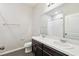This bathroom contains a toilet, a double sink vanity, and a shower at 10628 Massimo Dr, Wimauma, FL 33598