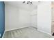 Bright bedroom with ceiling fan, gray carpet and neutral colored walls and closet at 10628 Massimo Dr, Wimauma, FL 33598