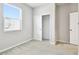 Bright bedroom with neutral walls, carpet floors, closet, and window at 10628 Massimo Dr, Wimauma, FL 33598