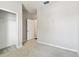 Bright bedroom with a closet and neutral walls and carpet flooring at 10628 Massimo Dr, Wimauma, FL 33598