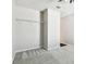 Bright bedroom with neutral walls and carpet, and a spacious closet at 10628 Massimo Dr, Wimauma, FL 33598