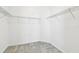 Walk-in closet with carpet and metal shelving at 10628 Massimo Dr, Wimauma, FL 33598