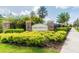Welcome to the Mirabella community, featuring lush landscaping and an inviting entrance at 10628 Massimo Dr, Wimauma, FL 33598