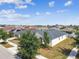 Aerial view of home in a well-planned community, showcasing its modern design and landscaped surroundings at 10628 Massimo Dr, Wimauma, FL 33598