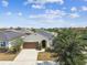 Charming single-Gathering home with a well-manicured lawn, a driveway, and a welcoming front entrance at 10628 Massimo Dr, Wimauma, FL 33598