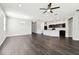 Spacious living area featuring modern floors, recessed lighting, and an open layout perfect for entertaining at 10628 Massimo Dr, Wimauma, FL 33598