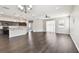 Open-concept living area with sleek floors and abundant natural light, seamlessly connecting to the kitchen at 10628 Massimo Dr, Wimauma, FL 33598