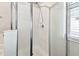 The enclosed shower features glass doors, tile walls, and modern fixtures at 10628 Massimo Dr, Wimauma, FL 33598