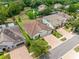 Aerial view of home showcasing its well-maintained lawn, long driveway, and prime location in a leafy neighborhood at 1104 Isobel Reserve Ln, Tampa, FL 33613