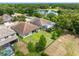 Aerial view of a backyard with a black fence, showcasing the home's proximity to a lake at 1104 Isobel Reserve Ln, Tampa, FL 33613