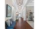 Inviting hallway with wood floors, decorative lighting, and stylish wall decor at 1104 Isobel Reserve Ln, Tampa, FL 33613