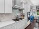 Modern kitchen with sleek countertops, stainless steel appliances, and natural lighting at 1104 Isobel Reserve Ln, Tampa, FL 33613