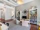 Open living area with hardwood floors, a built in bookshelf, and lots of natural light at 1104 Isobel Reserve Ln, Tampa, FL 33613