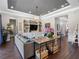 Bright living room features hardwood floors, built-in shelves, stylish decor, and neutral color palette at 1104 Isobel Reserve Ln, Tampa, FL 33613