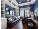 Bright office with a built in bookshelf, hardwood floors, and a nice view of the yard at 1104 Isobel Reserve Ln, Tampa, FL 33613
