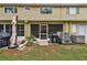 View of backyard with an enclosed lanai at 11162 Kapok Grand Cir, Madeira Beach, FL 33708
