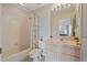 Clean bathroom with a tub-shower combo and a single sink vanity at 11162 Kapok Grand Cir, Madeira Beach, FL 33708