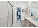Bathroom with a white shower and vanity at 11162 Kapok Grand Cir, Madeira Beach, FL 33708