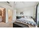 Well-lit bedroom featuring neutral colors, carpeted floors, and a walk-in closet, creating a welcoming retreat at 11162 Kapok Grand Cir, Madeira Beach, FL 33708