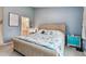 Comfortable bedroom with blue walls and carpet at 11162 Kapok Grand Cir, Madeira Beach, FL 33708