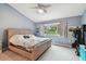 Bright bedroom with a large window overlooking green space at 11162 Kapok Grand Cir, Madeira Beach, FL 33708