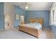 Bright bedroom featuring a decorative ceiling fan and a wicker-style platform bed at 11162 Kapok Grand Cir, Madeira Beach, FL 33708