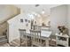 Bright dining room with white wood floors and decor at 11162 Kapok Grand Cir, Madeira Beach, FL 33708