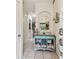 Entryway features tile flooring, an arched doorway, and a charming decor accented dresser at 11162 Kapok Grand Cir, Madeira Beach, FL 33708
