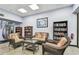 Inviting lounge area with comfortable seating and extensive bookshelves at 11162 Kapok Grand Cir, Madeira Beach, FL 33708