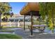 Outdoor seating area with pond views at 11162 Kapok Grand Cir, Madeira Beach, FL 33708