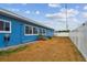 Backyard with a privacy fence and blue house at 11762 82Nd Ter, Seminole, FL 33772