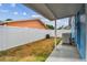 View of fenced backyard featuring patio cover and ample space at 11762 82Nd Ter, Seminole, FL 33772