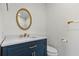 Elegant bathroom with a blue vanity, a white countertop and modern fixtures at 11762 82Nd Ter, Seminole, FL 33772