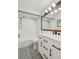Bathroom with a white vanity, quartz countertop, and patterned tile floor at 11762 82Nd Ter, Seminole, FL 33772