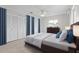 Well-lit bedroom with a comfortable bed, ceiling fan, and ample closet space at 11762 82Nd Ter, Seminole, FL 33772