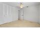 Bedroom featuring a ceiling fan and a spacious closet, offering comfort and storage at 11762 82Nd Ter, Seminole, FL 33772