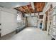 Spacious garage with shelving, wood ceiling, and a garage door at 11762 82Nd Ter, Seminole, FL 33772
