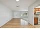 Bright living room featuring wood floors, a large window, and neutral walls at 11762 82Nd Ter, Seminole, FL 33772