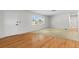 Bright living room with wood floors and a large window offers natural light at 11762 82Nd Ter, Seminole, FL 33772