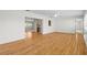 Open living area with hardwood flooring that flows seamlessly for flexible design at 11762 82Nd Ter, Seminole, FL 33772